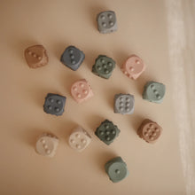Load image into Gallery viewer, Dice Press Toy 2-Pack - Cambridge Blue / Shifting Sand
