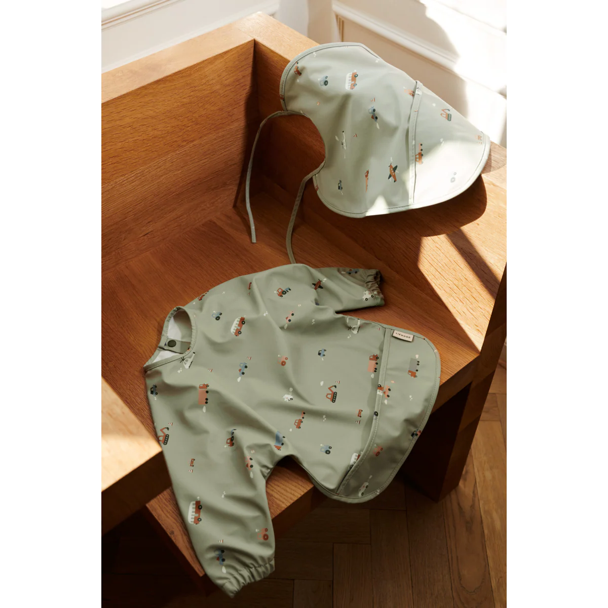 Merle Ruffle Cape Bib - Vehicles/dove blue mix