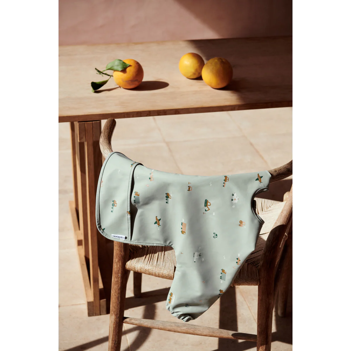 Merle Ruffle Cape Bib - Vehicles/dove blue mix